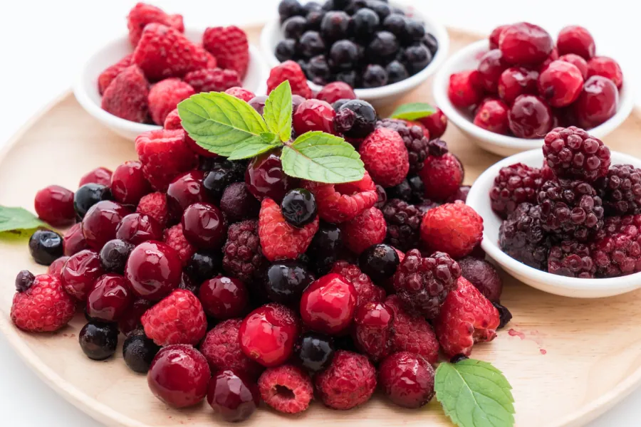 A colorful mix of fresh blueberries, raspberries, and blackberries, rich in antioxidants.